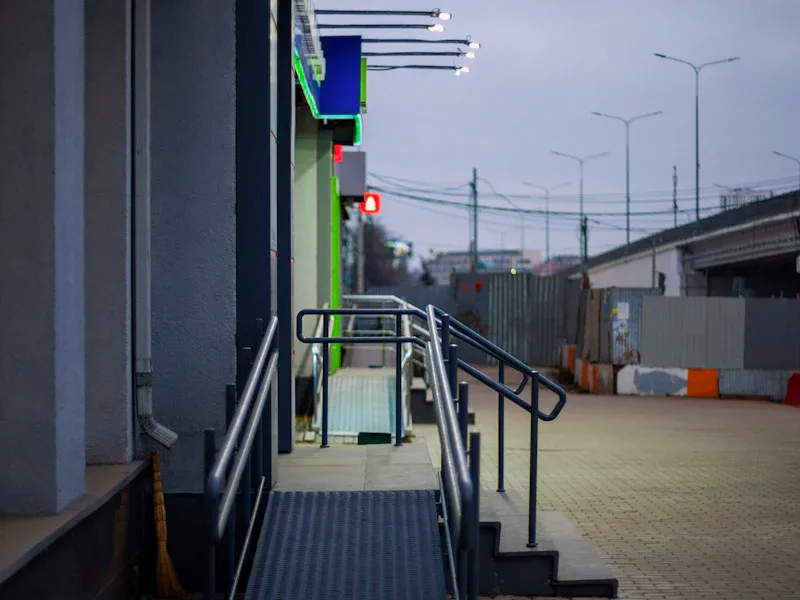 ADA compliant concrete accessibility ramp with handrails ADA compliant concrete accessibility ramp with handrails