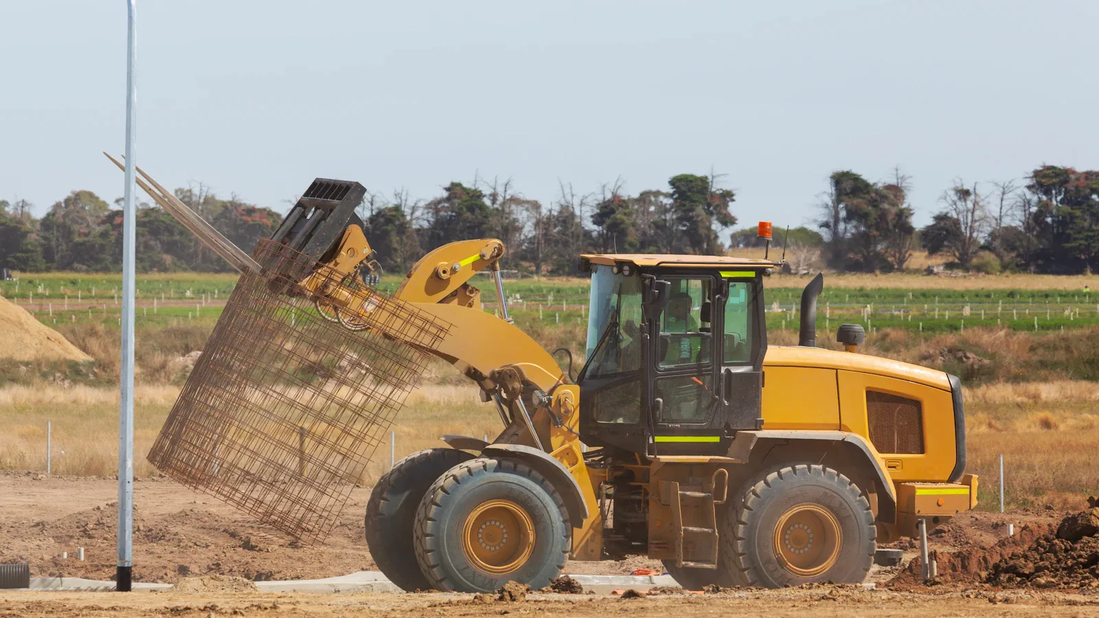 Bulldozer excavating soil during commercial site preparation in Harrisburg, PA