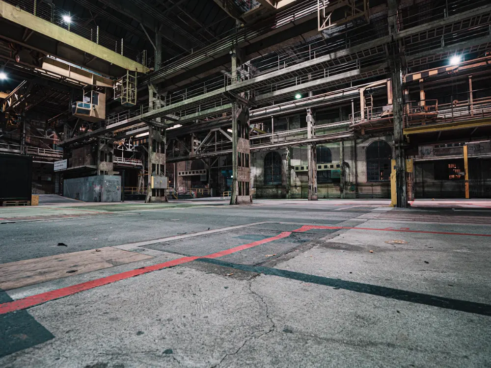 Large industrial facility interior with a concrete floor