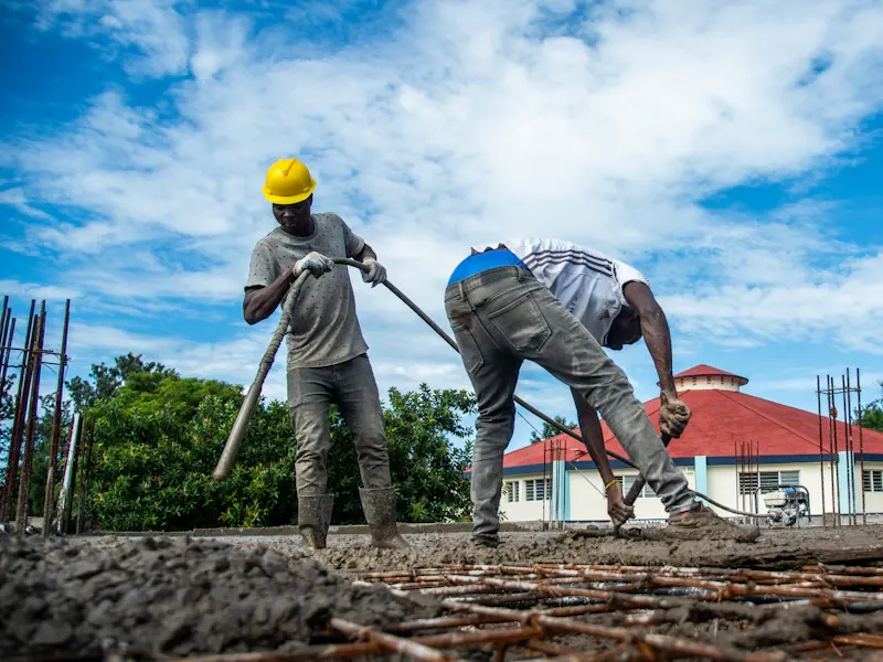 Construction crew pouring concrete