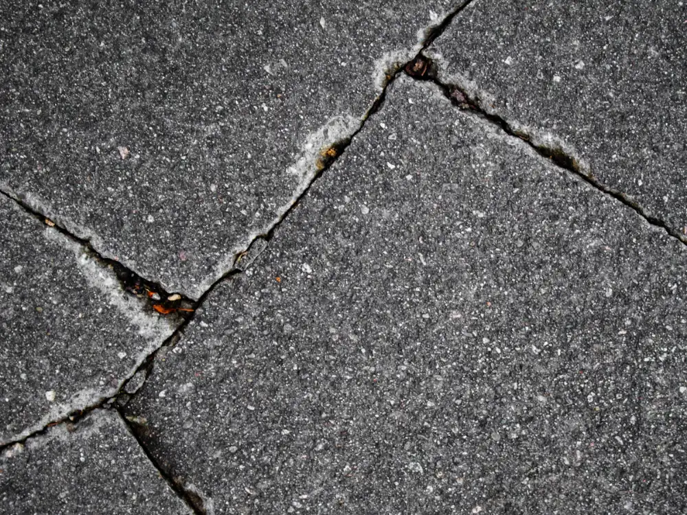 Cracked commercial concrete that needs repair before it becomes a liability Cracked commercial concrete that needs repair before it becomes a liability