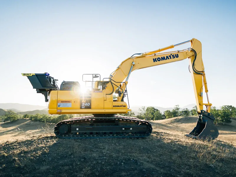 Excavator trenching for commercial foundation and utility work