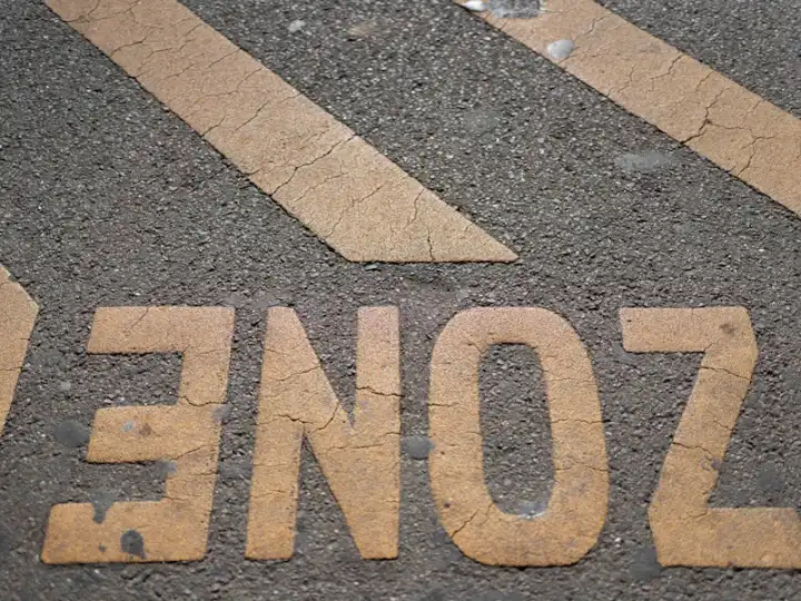 Freshly painted yellow pavement markings and stripes
