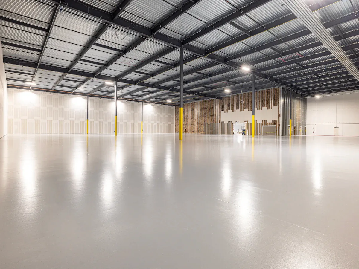 Industrial warehouse with a heavy-duty concrete floor Industrial warehouse with a heavy-duty concrete floor