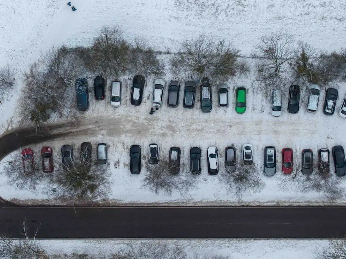 Snow-covered commercial parking lot in winter