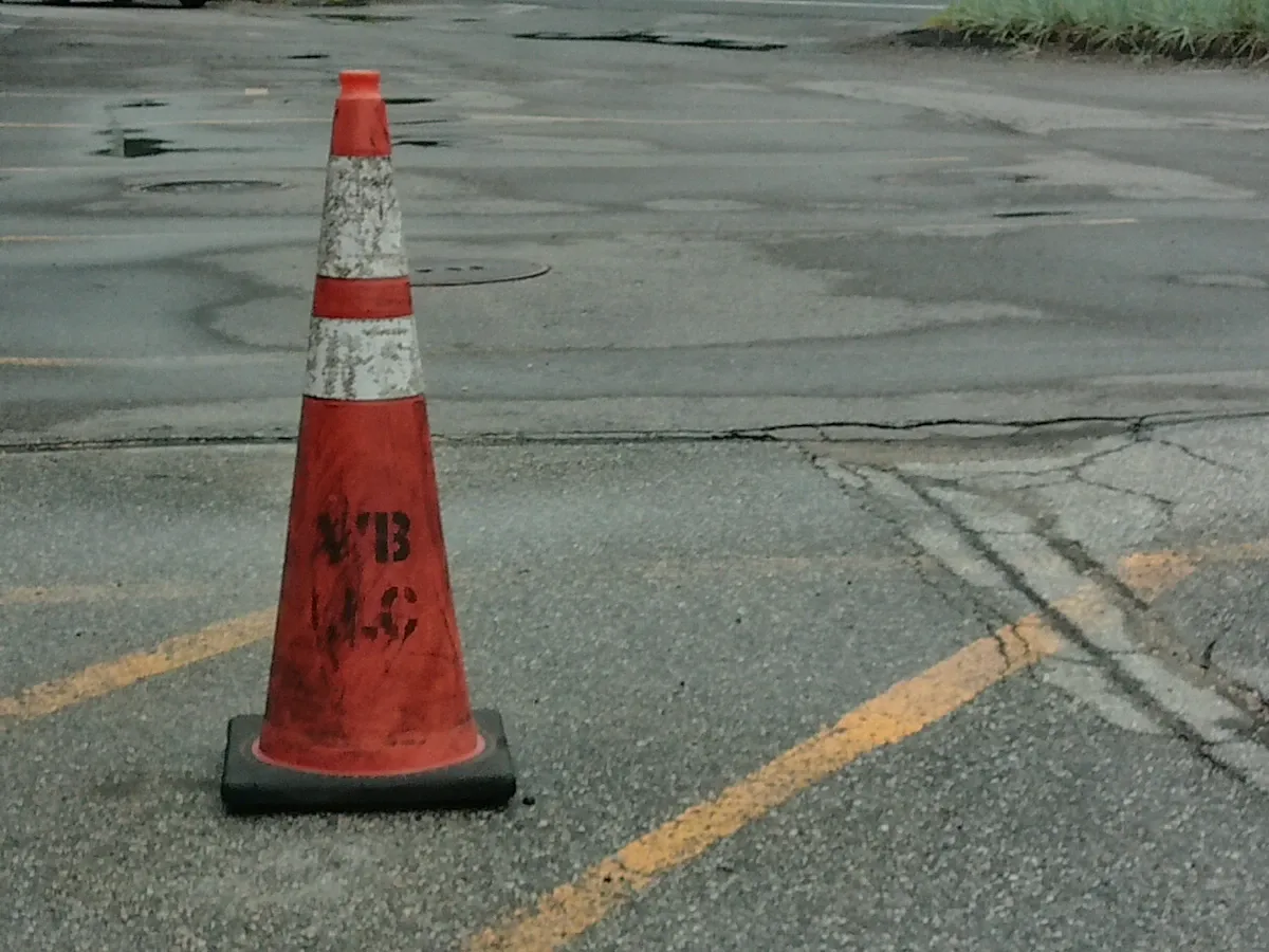 Traffic cone marking off a parking lot work area